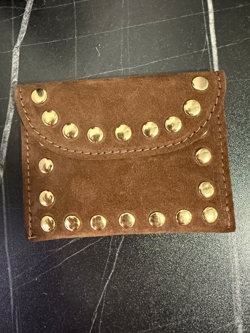 Monedero tachas